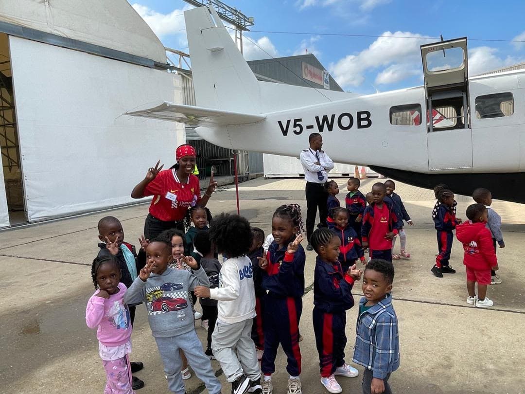 Children visiting an aeroplane on an academy outing
